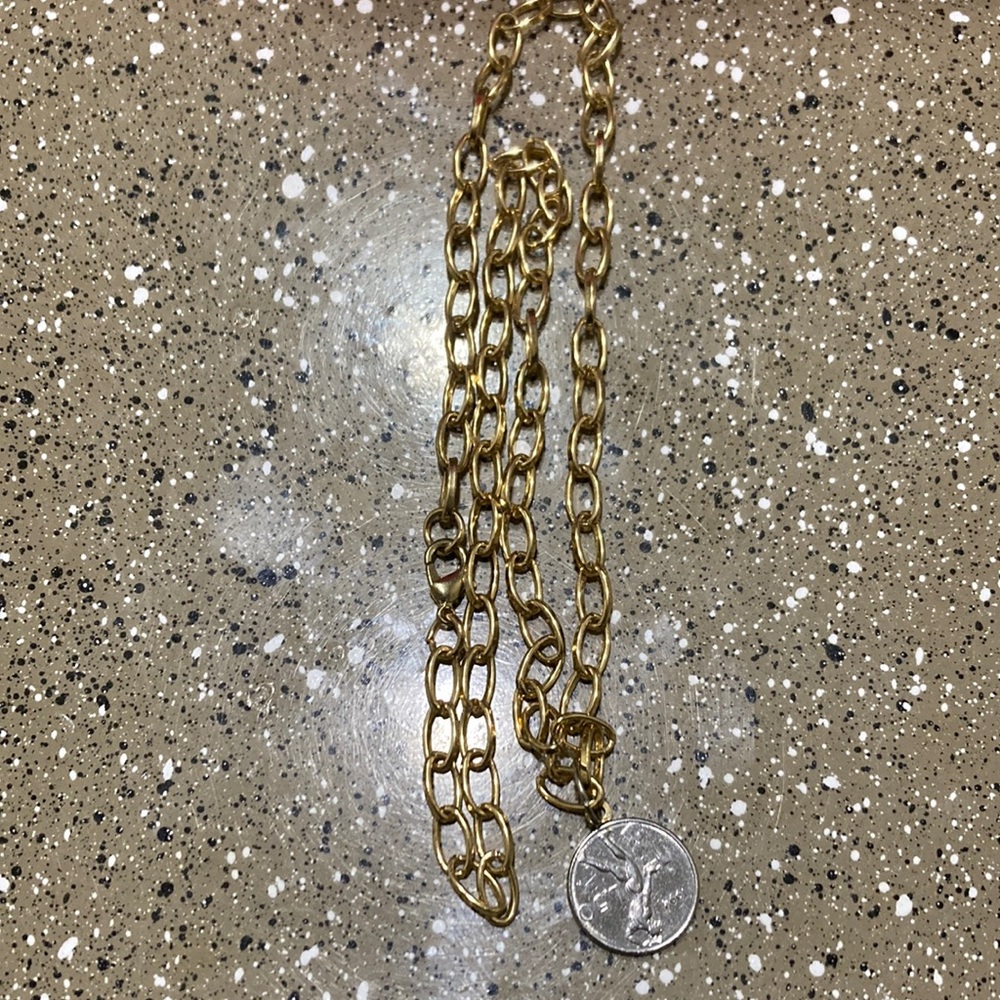 14k gold bale connected to a real Italian coin